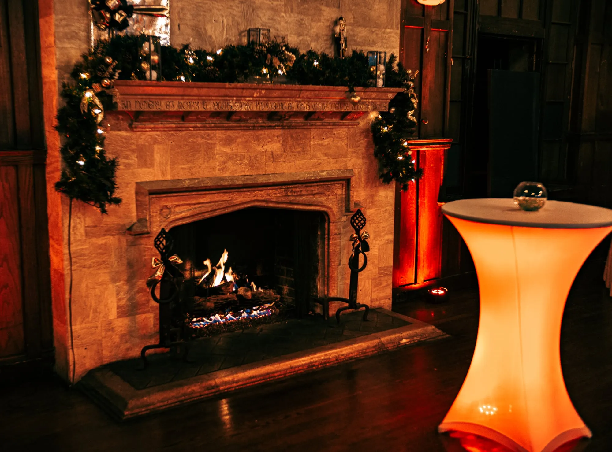 A glowing fireplace and holiday décor set the scene at the Denver Winter Ball