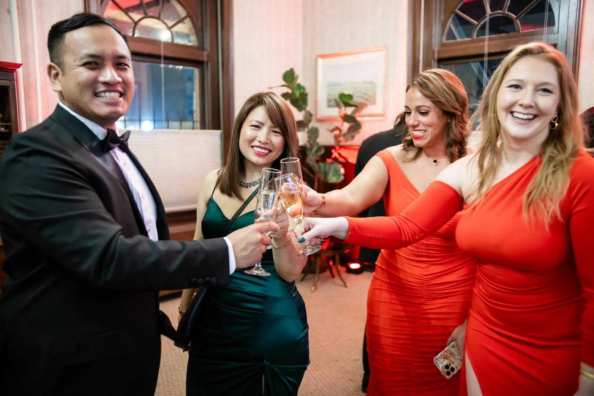 Black-tie guests raise a champagne toast at the Denver Winter Ball